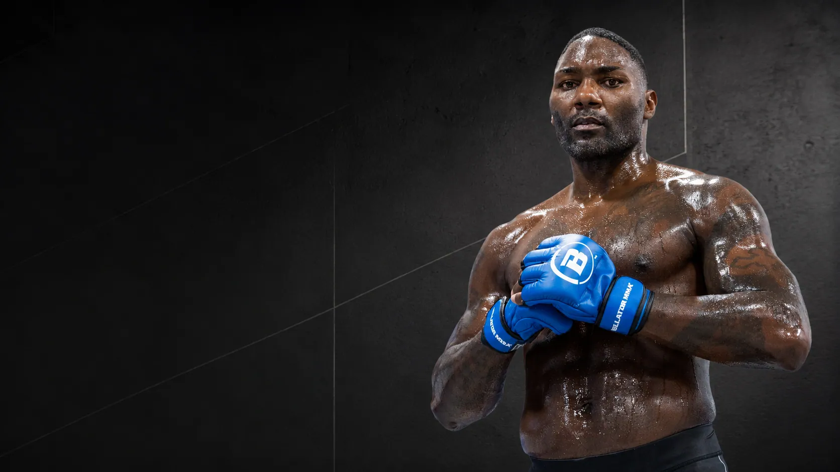 Anthony “Rumble” Johnson photographed for his comeback, arms folded, looking directly at camera.